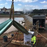 photo of the grantt power plant worksite - showing a small crane lifting equipment