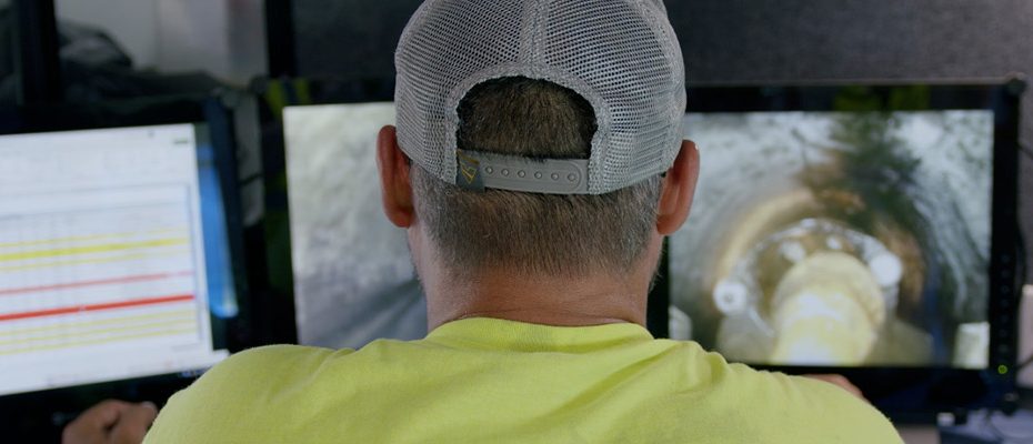 a worker monitoring CCTV screens